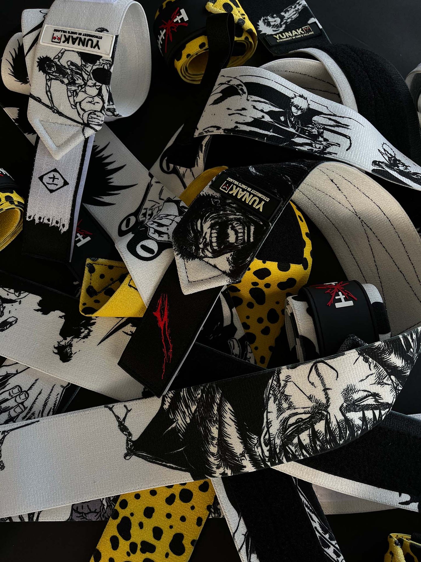A mystery bundle containing one random pair of wrist wraps with anime inspired design. Picture shows a number of the anime wrist wraps that can be inside the package