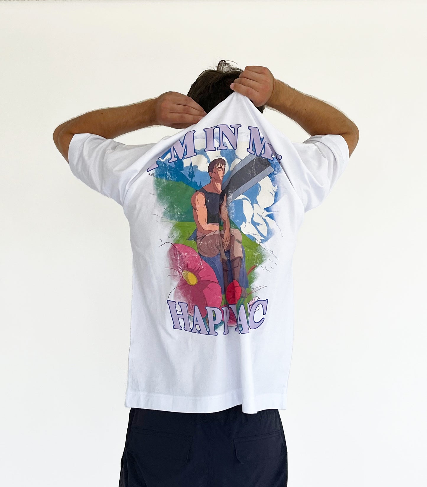 An oversized tshirt inspired by Guts from Berserk. Anime Pump Cover for the gym with Happy arc text and smiling Guts from Berserk