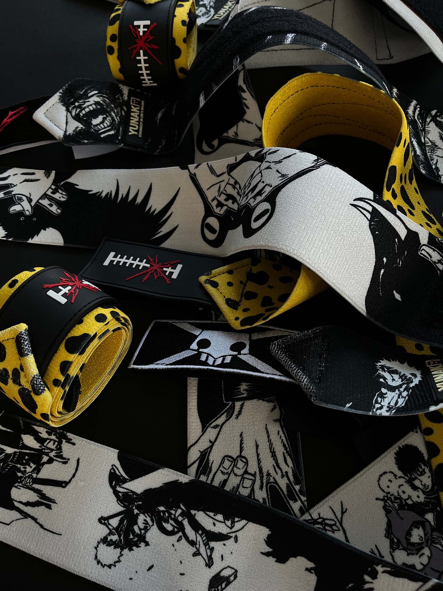 A mystery bundle containing one random pair of wrist wraps with anime inspired design. Picture shows a number of the anime wrist wraps that can be inside the package