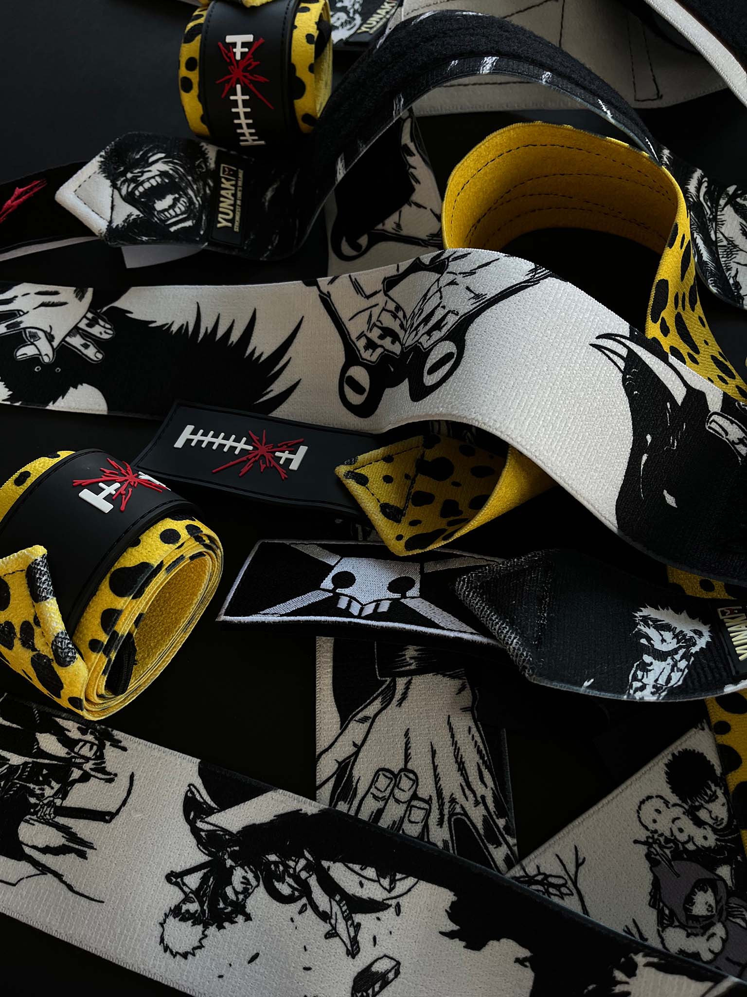 A mystery bundle containing one random pair of wrist wraps with anime inspired design. Picture shows a number of the anime wrist wraps that can be inside the package
