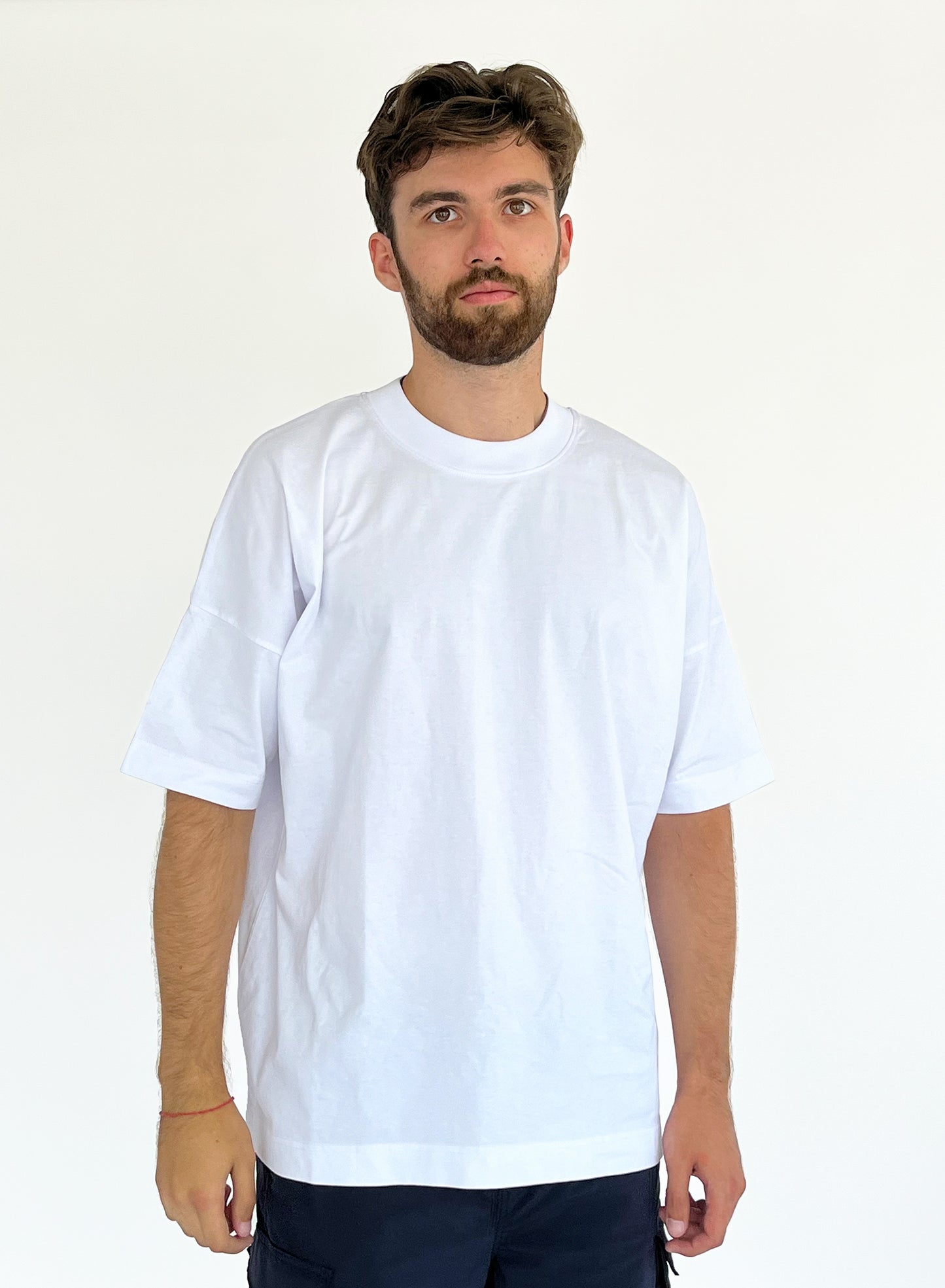 An oversized tshirt inspired by Guts from Berserk. Anime Pump Cover for the gym with Happy arc text and smiling Guts from Berserk