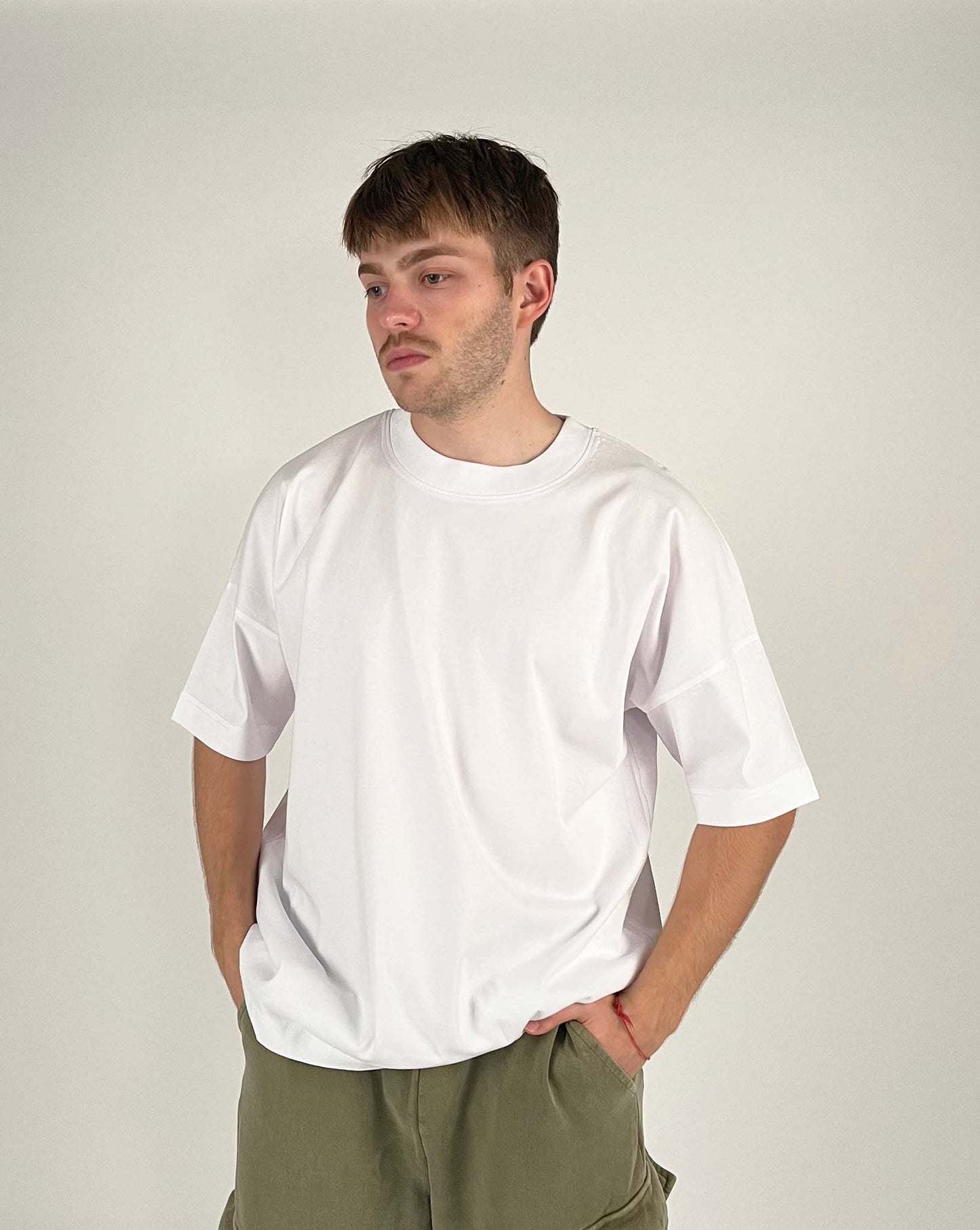 An oversized tshirt inspired by Zaraki Kenpachi from Bleach. Anime Pump Cover for the gym with Nozarashi text at top and Zaraki Kenpachi from Bleach. Text at bottom "You're not truly defeated until you die". Male model front design