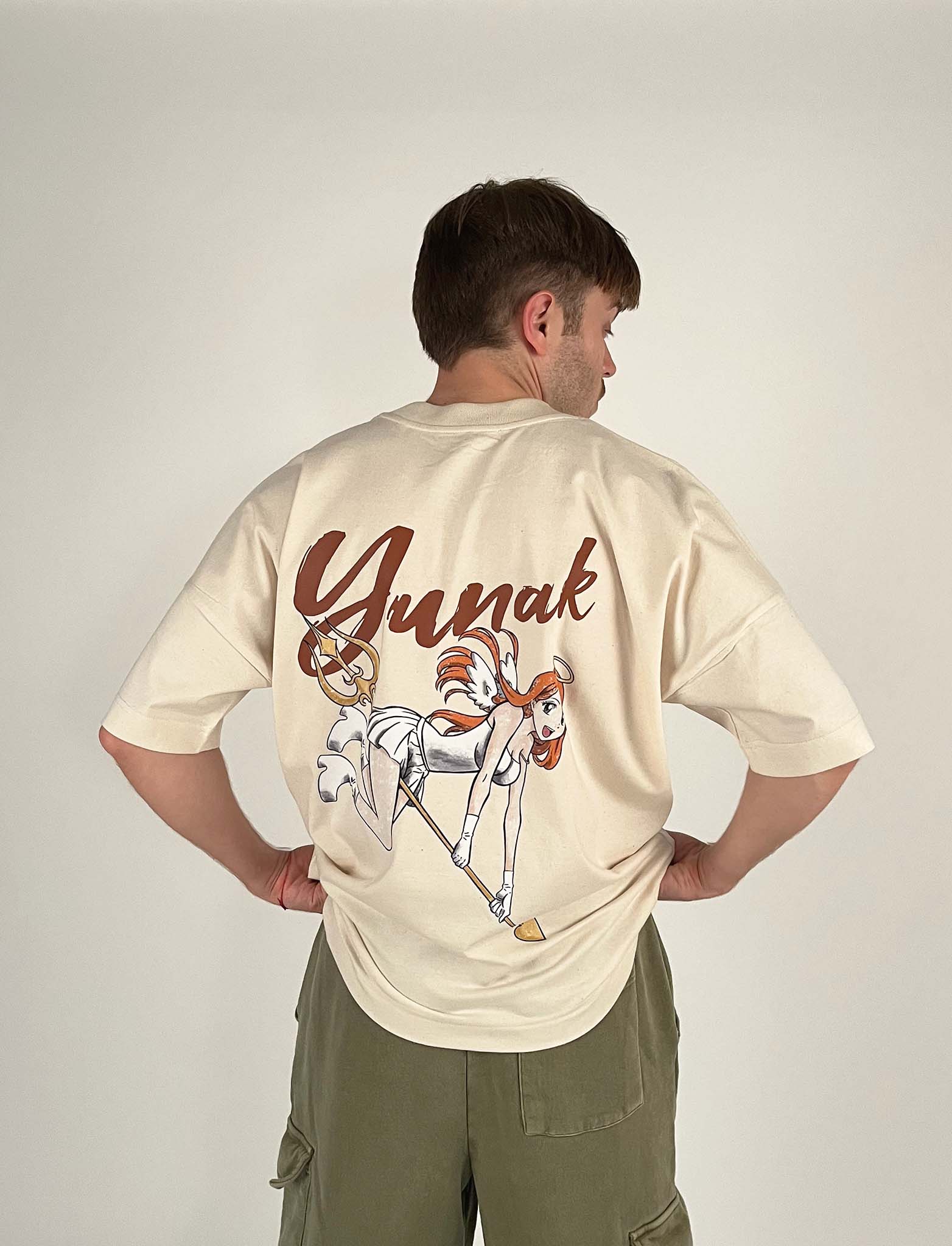 An oversized tshirt inspired by Orihime from Bleach. Anime Pump Cover for the gym with Yunak text and Orihime drawn as an angel from Bleach. Male model back design