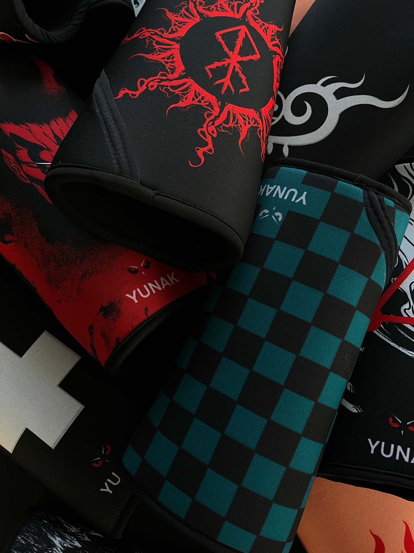 A mystery bundle containing one random pair of knee sleeves with anime inspired design. Picture shows a number of the anime knee sleeves that can be inside the package