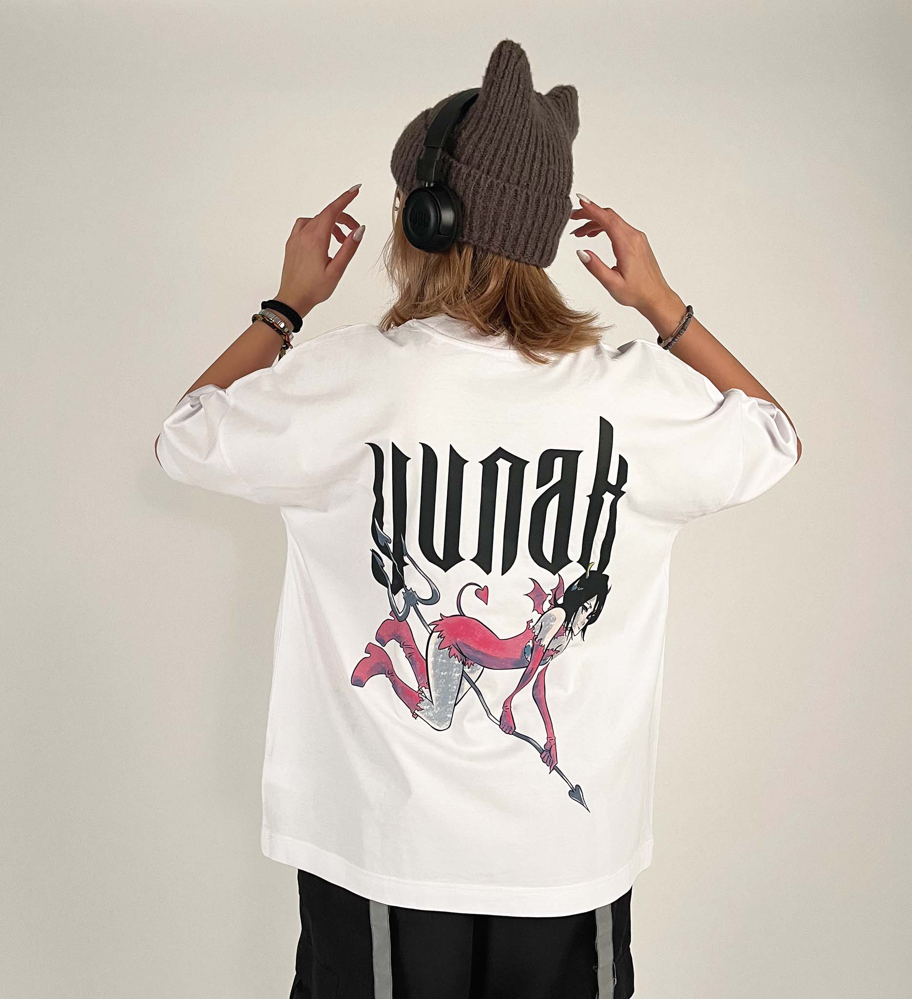 An oversized tshirt inspired by Rukia from Bleach. Anime Pump Cover for the gym with Yunak text and Rukia drawn as a demon from Bleach. Female model back design