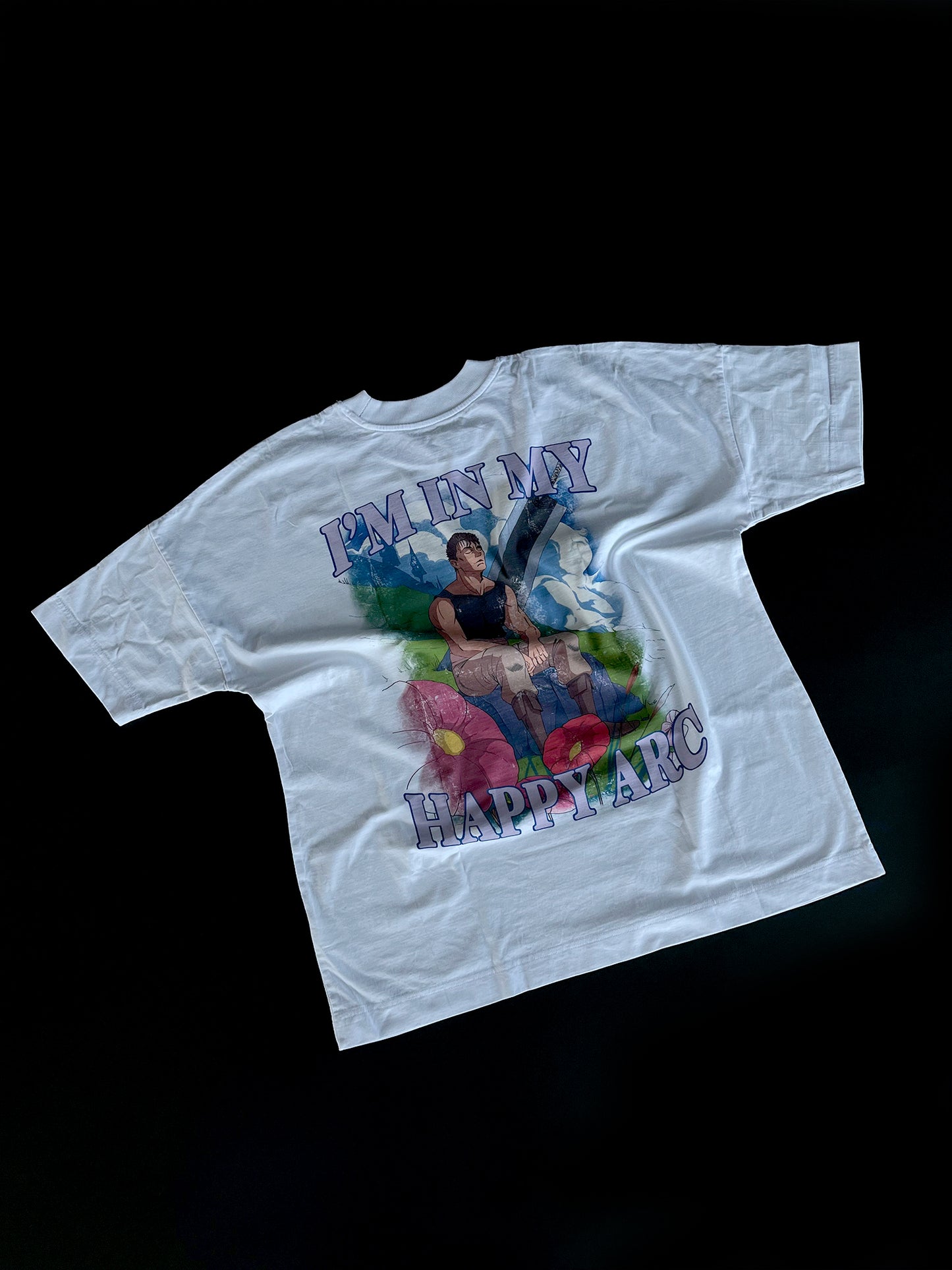 An oversized tshirt inspired by Guts from Berserk. Anime Pump Cover for the gym with Happy arc text and smiling Guts from Berserk