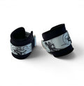 A pair of cable cuffs inspired by Rukia from Bleach. Top-down view