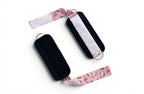 A pair of cable cuffs inspired by Hello Kitty from Sanrio