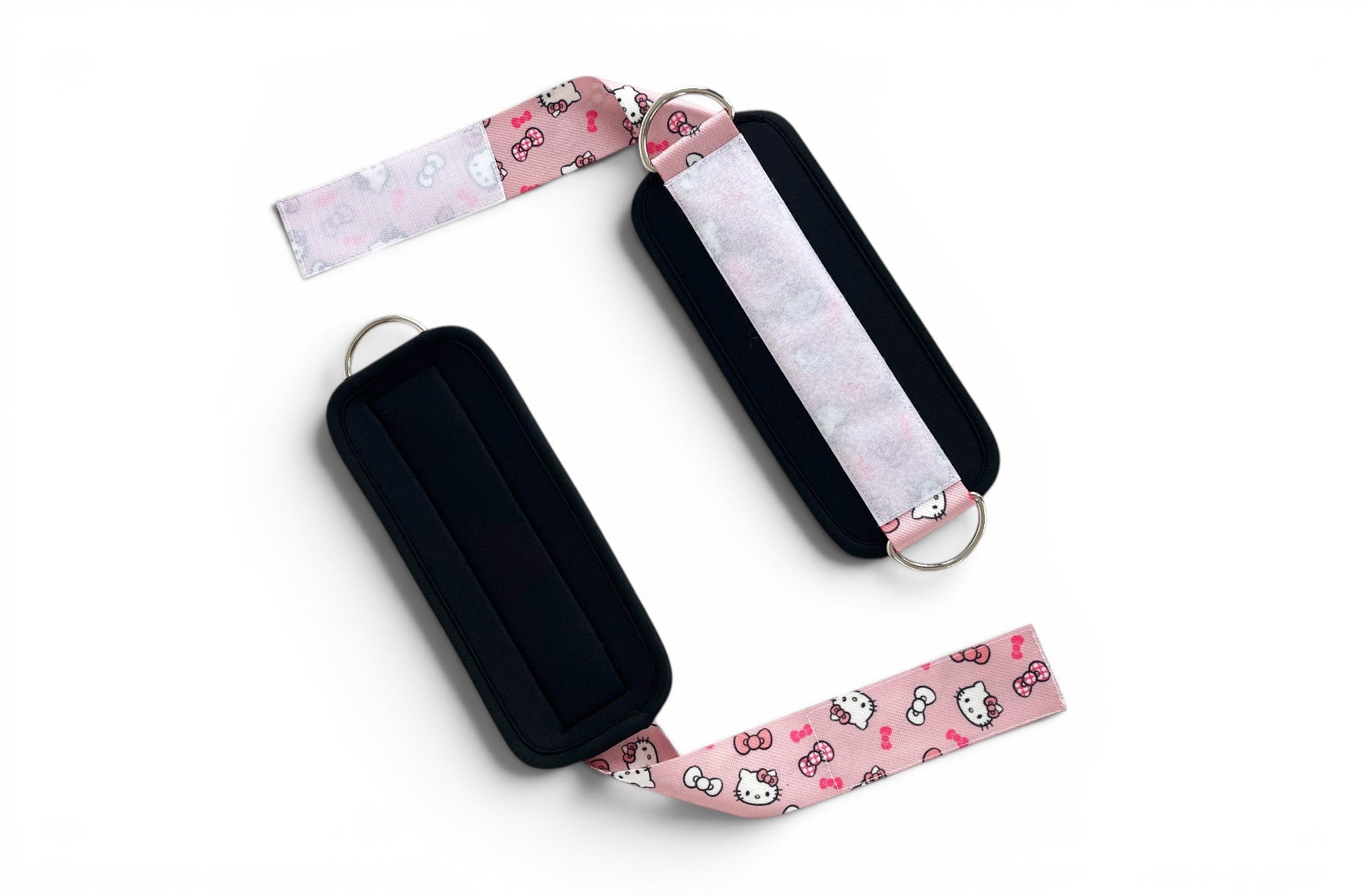 A pair of cable cuffs inspired by Hello Kitty from Sanrio