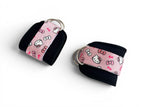 A pair of cable cuffs inspired by Hello Kitty from Sanrio