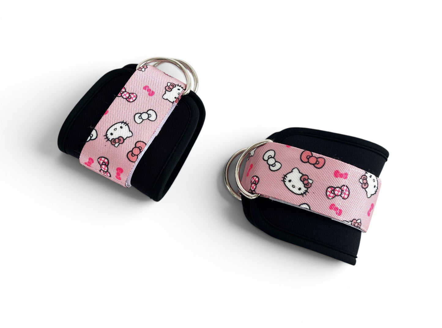 A pair of cable cuffs inspired by Hello Kitty from Sanrio