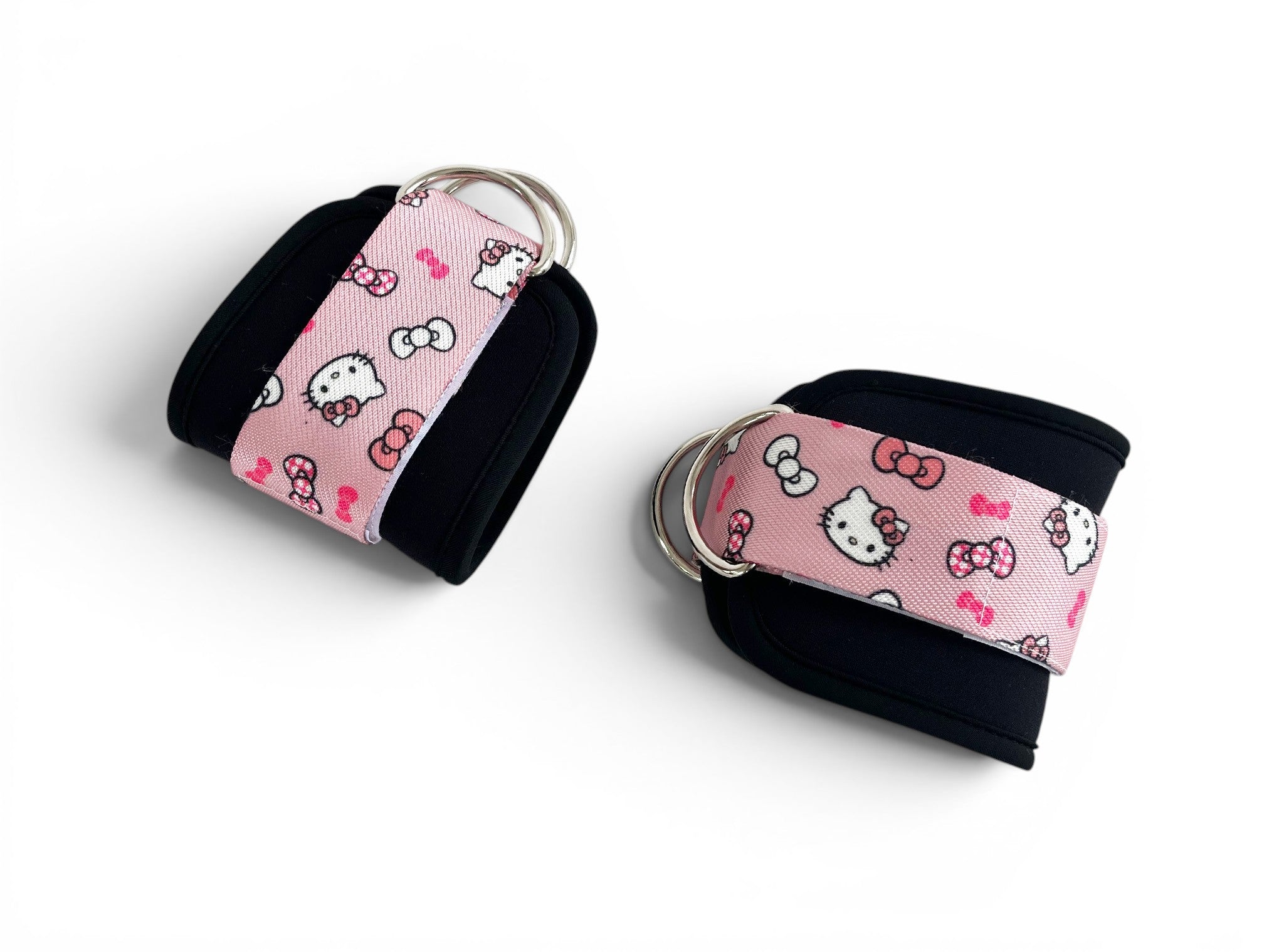 A pair of cable cuffs inspired by Hello Kitty from Sanrio