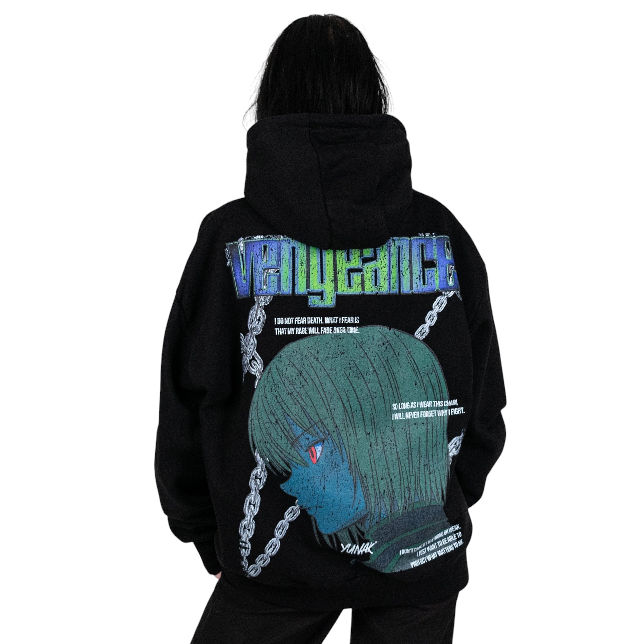 Person wearing a black hoodie with graphic design of Kurapika from HunterxHunter on the back, standing against a white background