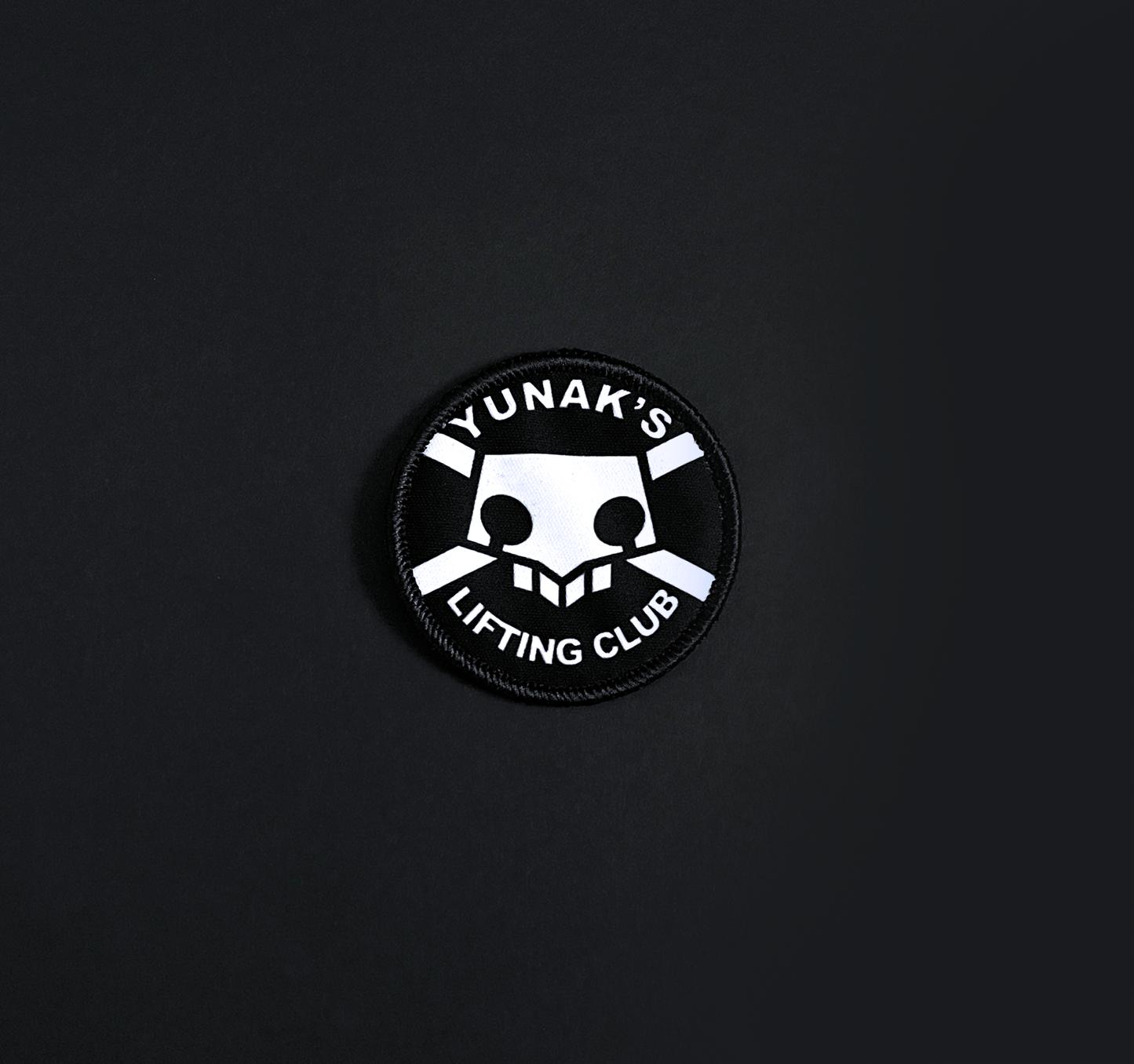A top down view of the Yunak's Lifting Club embroidery patch