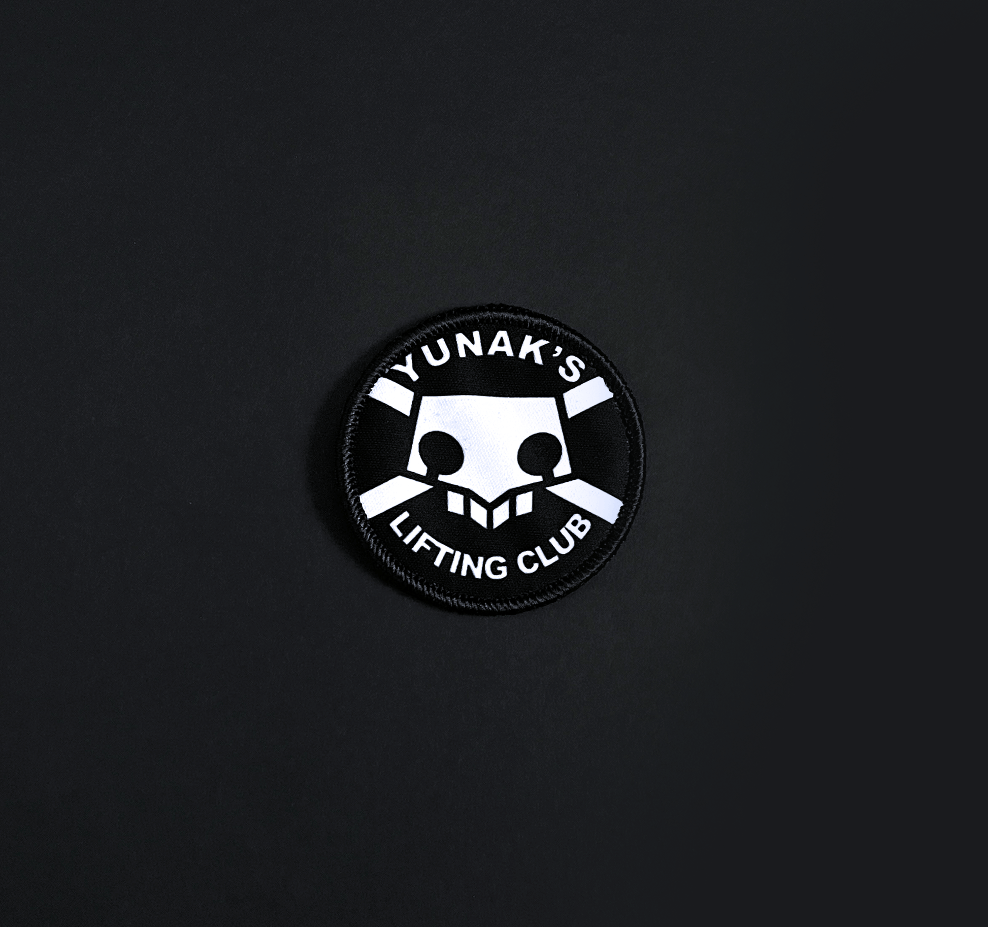 A top down view of the Yunak's Lifting Club embroidery patch