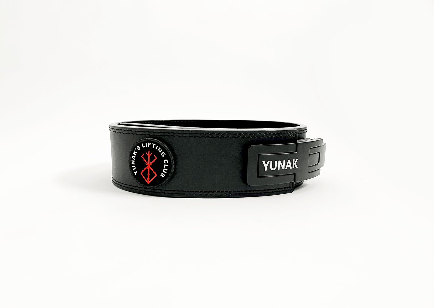 An anime powerlifting belt, 13mm thick and 4 inch wide. Featuring 4 embroidery patches inspired by Berserk. Fourth patch is a Yunak's Lifting Club patch. The photo is side view of the belt.