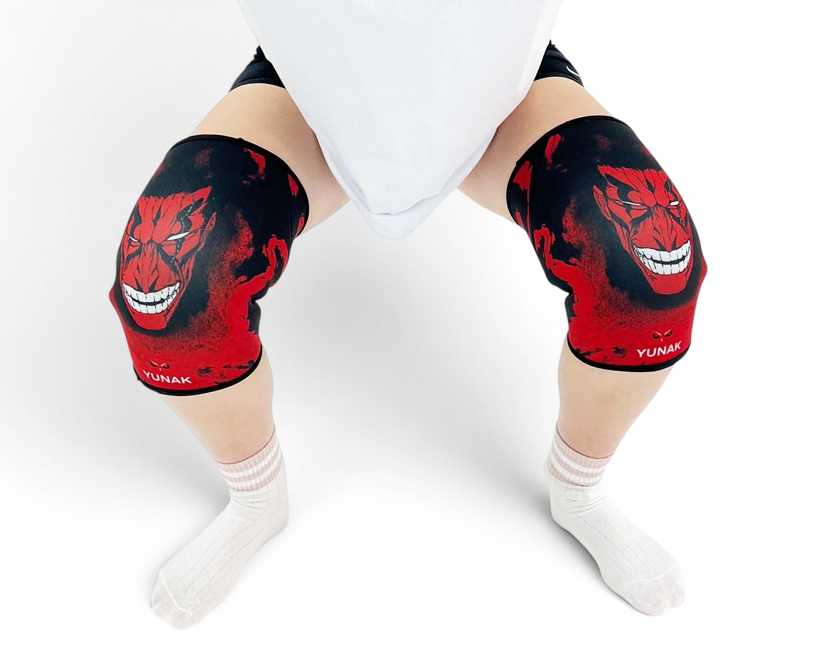 7mm thick knee sleeves inspired by Kenpachi from Bleach. Anime knee sleeves for the gym with Zaraki anime design for weightlifting. Detail shot in squatting position