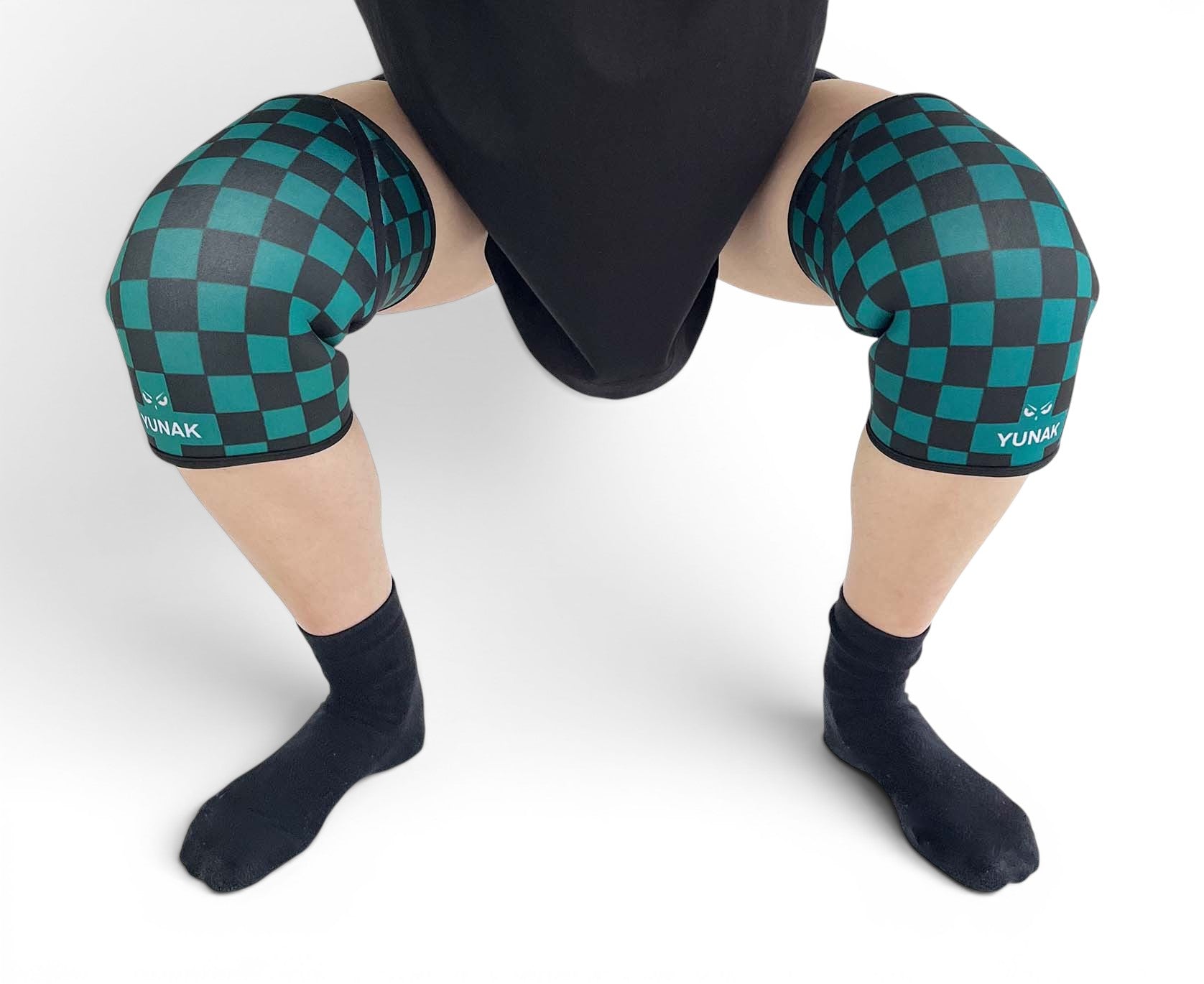 7mm thick knee sleeves inspired by Tanjiro from Demon Slayer. Anime knee sleeves for the gym with demon slayer anime design for weightlifting. Close up shot in squatting position