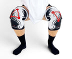 7mm thick knee sleeves inspired by Megumi from Jujutsu Kaisen. Anime knee sleeves for the gym with jjk shikigami anime design for weightlifting. Close up shot in squatting position