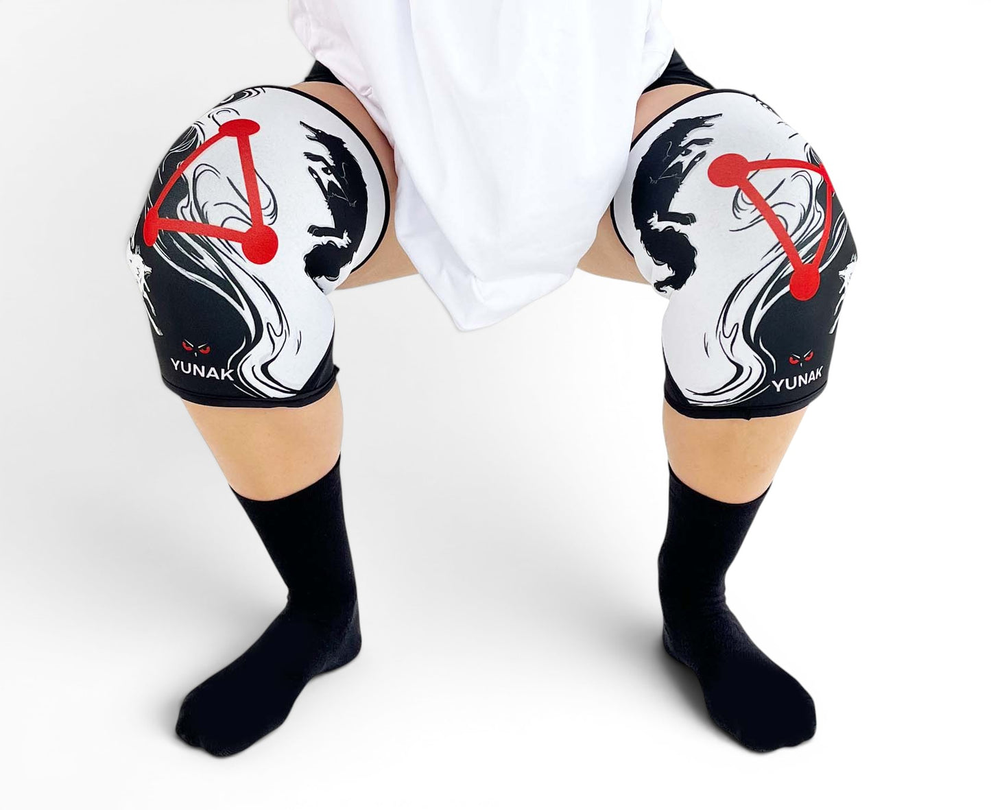 7mm thick knee sleeves inspired by Megumi from Jujutsu Kaisen. Anime knee sleeves for the gym with jjk shikigami anime design for weightlifting. Close up shot in squatting position