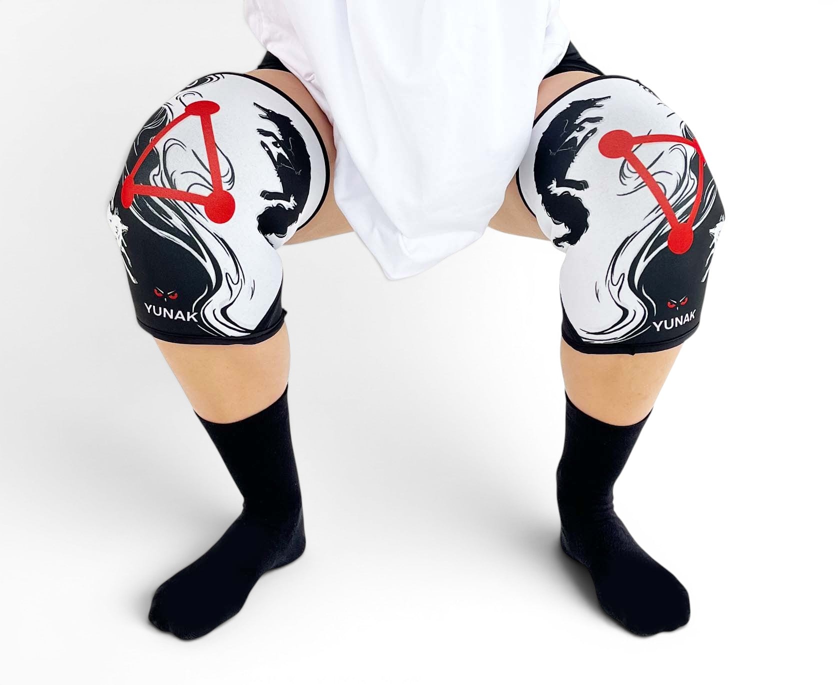 7mm thick knee sleeves inspired by Megumi from Jujutsu Kaisen. Anime knee sleeves for the gym with jjk shikigami anime design for weightlifting. Close up shot in squatting position