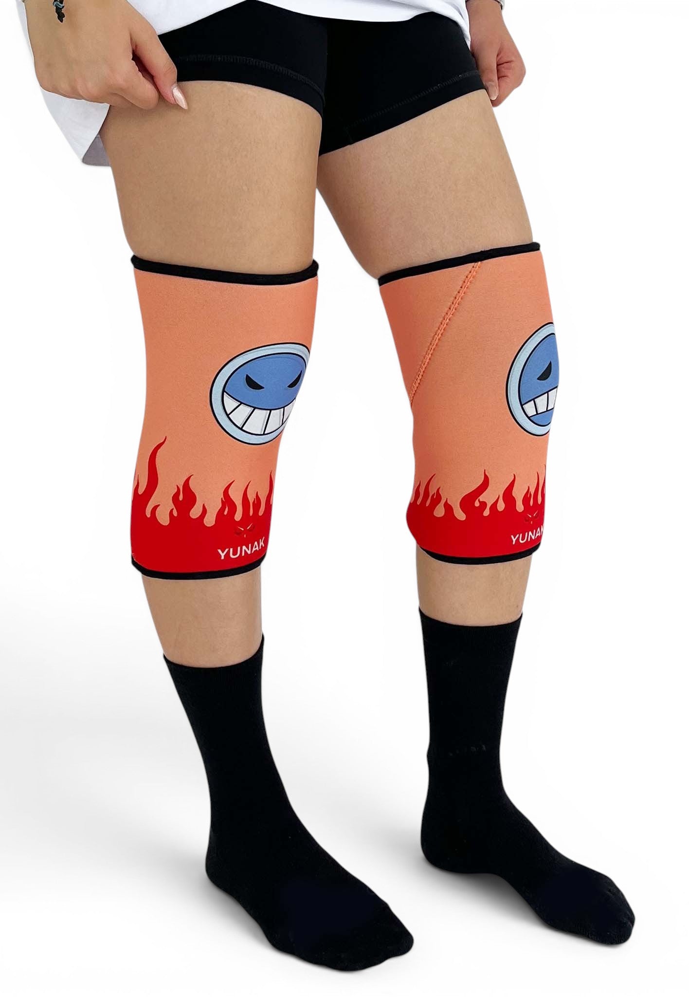 7mm thick knee sleeves inspired by Ace from One Piece. Anime knee sleeves for the gym with Ace anime design for weightlifting. Shot from the side