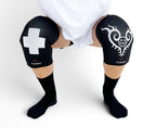 7mm thick knee sleeves inspired by Trafalgar Law from One Piece. Anime knee sleeves for the gym with Trafalgar Law anime design for weightlifting. Detail shot in squatting position