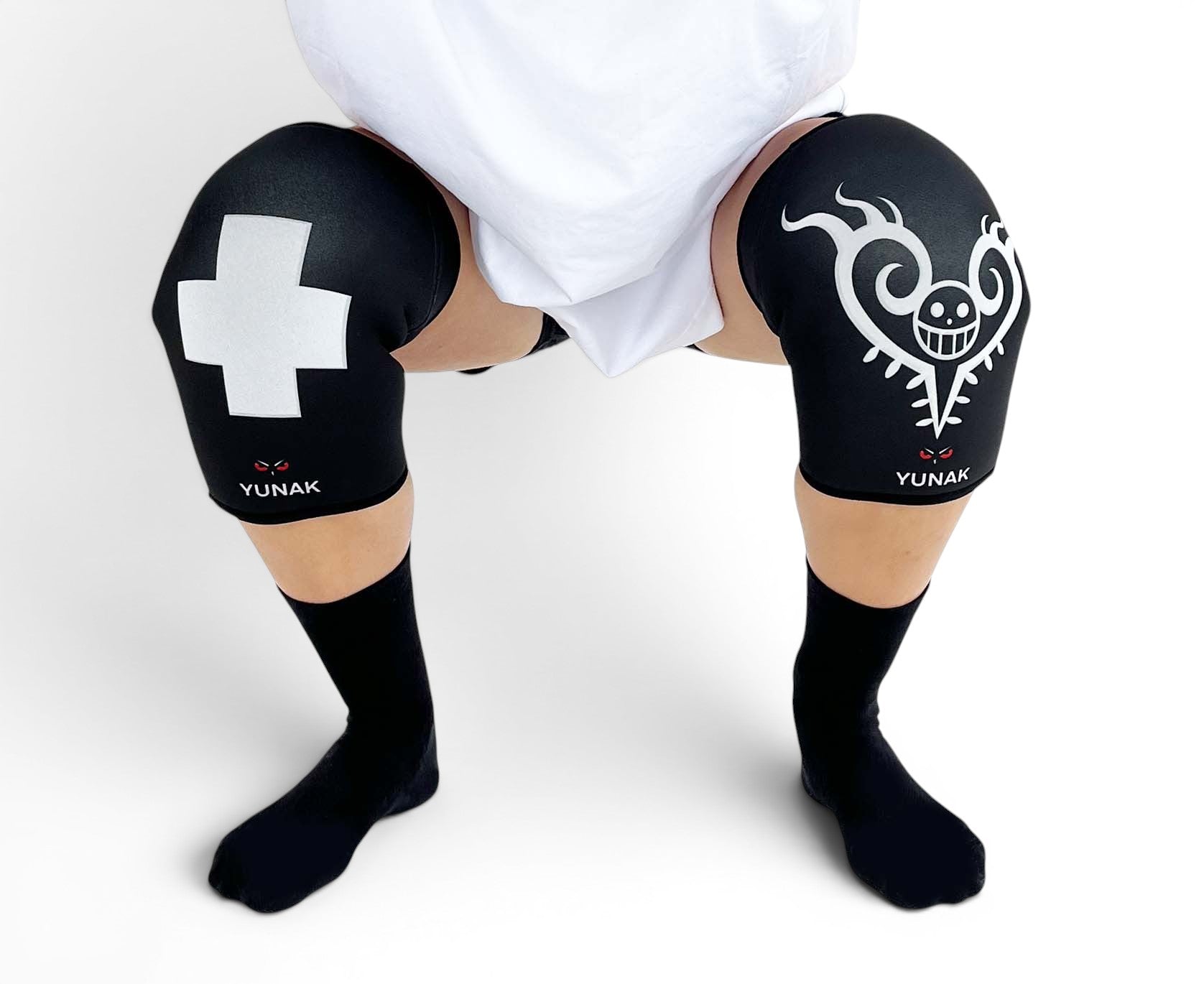 7mm thick knee sleeves inspired by Trafalgar Law from One Piece. Anime knee sleeves for the gym with Trafalgar Law anime design for weightlifting. Detail shot in squatting position