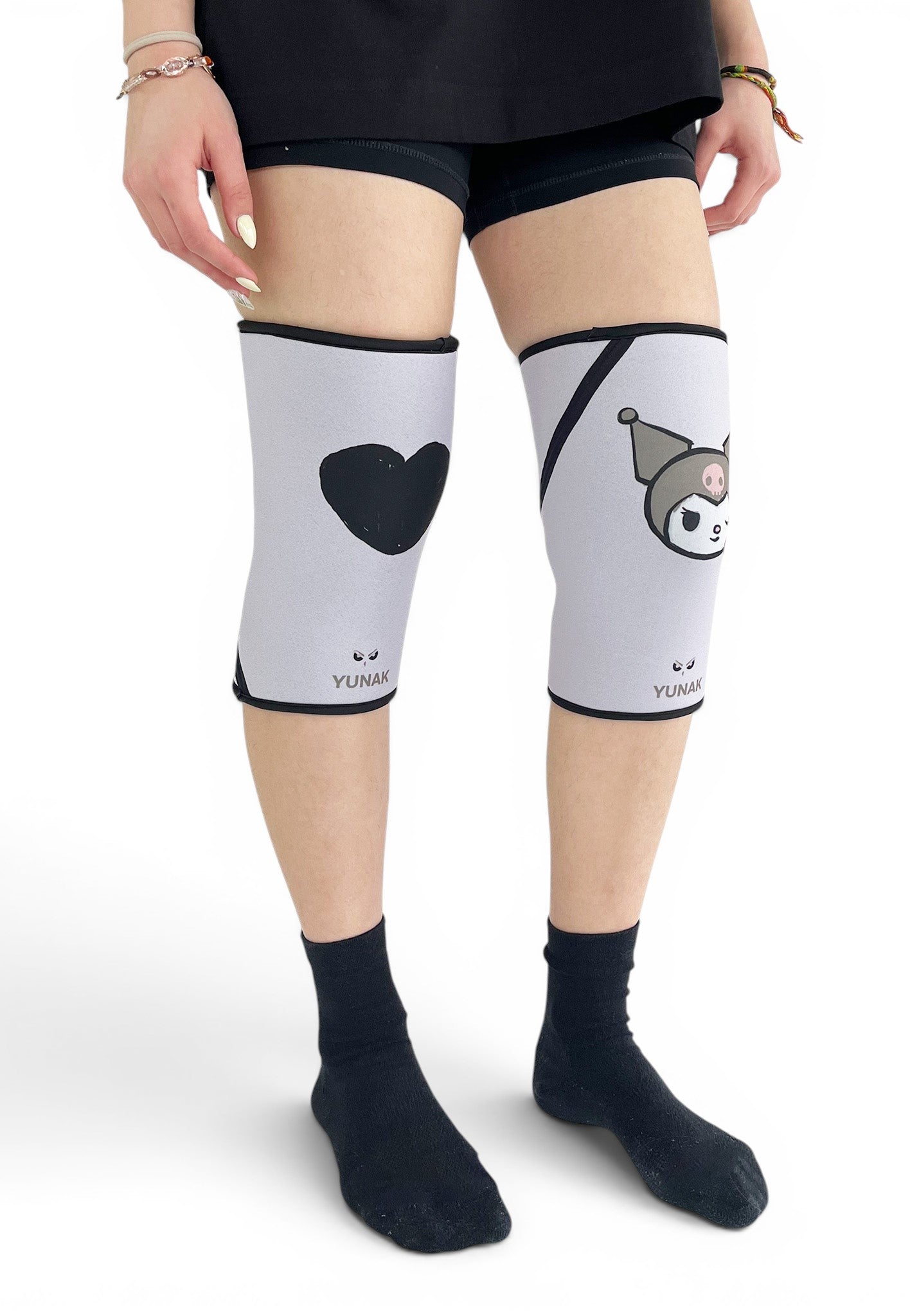 7mm thick knee sleeves inspired by Kuromi from Sanrio. Anime knee sleeves for the gym with Hello Kitty anime design for weightlifting. Shot from the side