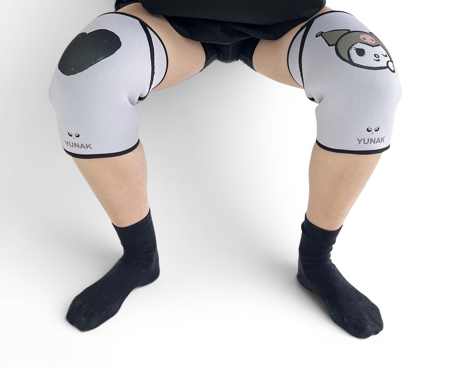 7mm thick knee sleeves inspired by Kuromi from Sanrio. Anime knee sleeves for the gym with Hello Kitty anime design for weightlifting. Detail shot in squatting position
