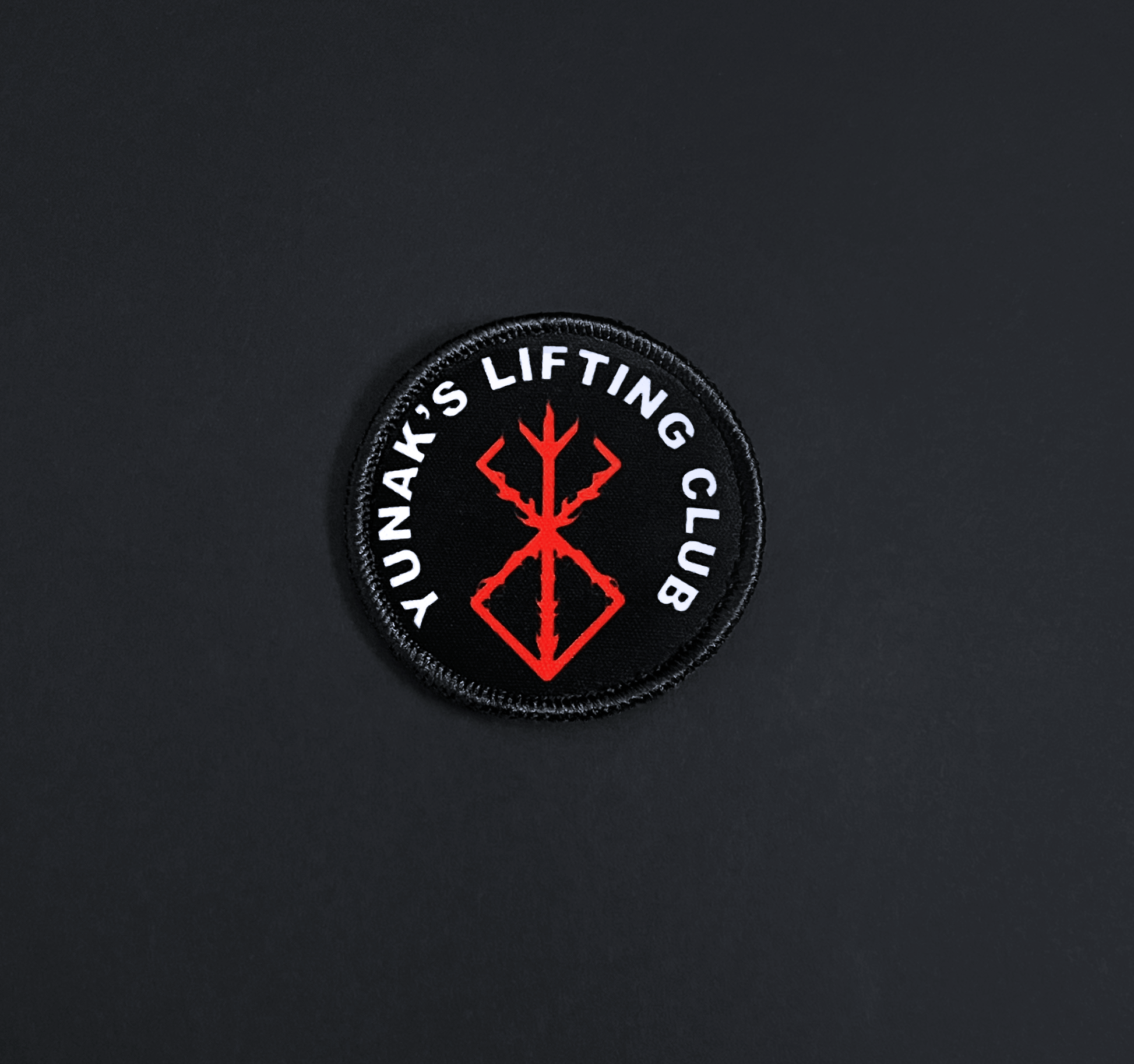 A top down view of the Yunak's Lifting Club embroidery patch