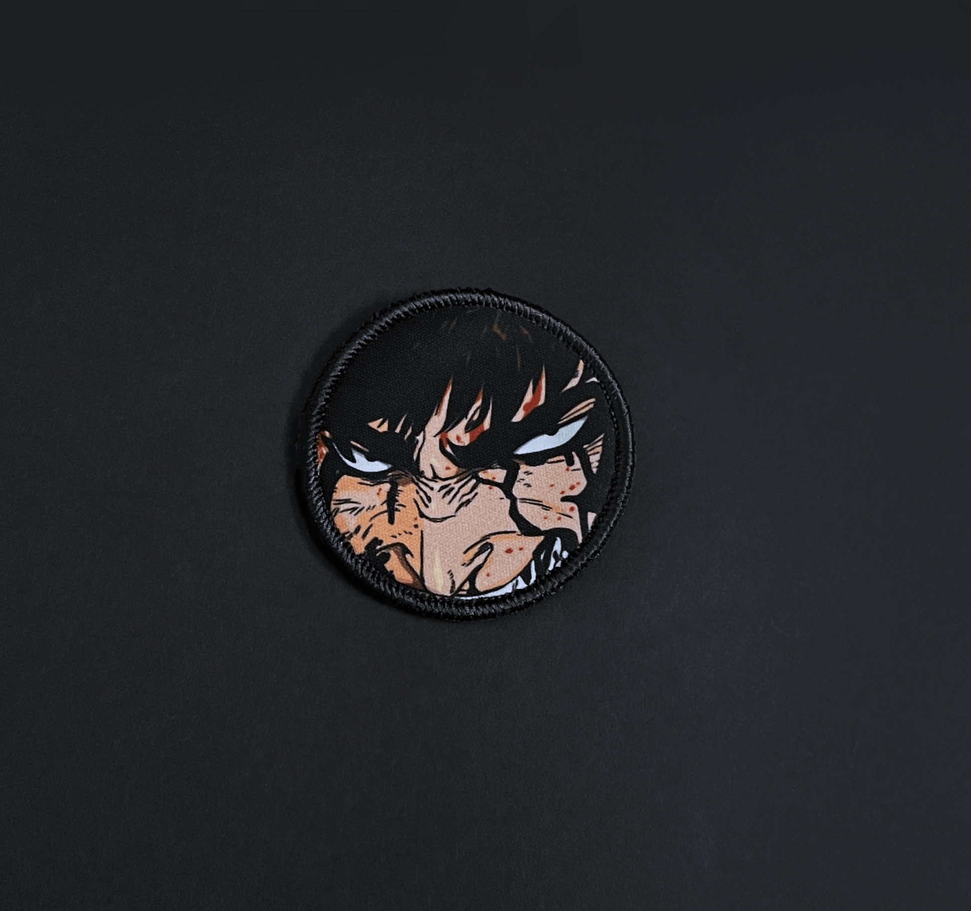 A top down view of the Guts embroidery patch