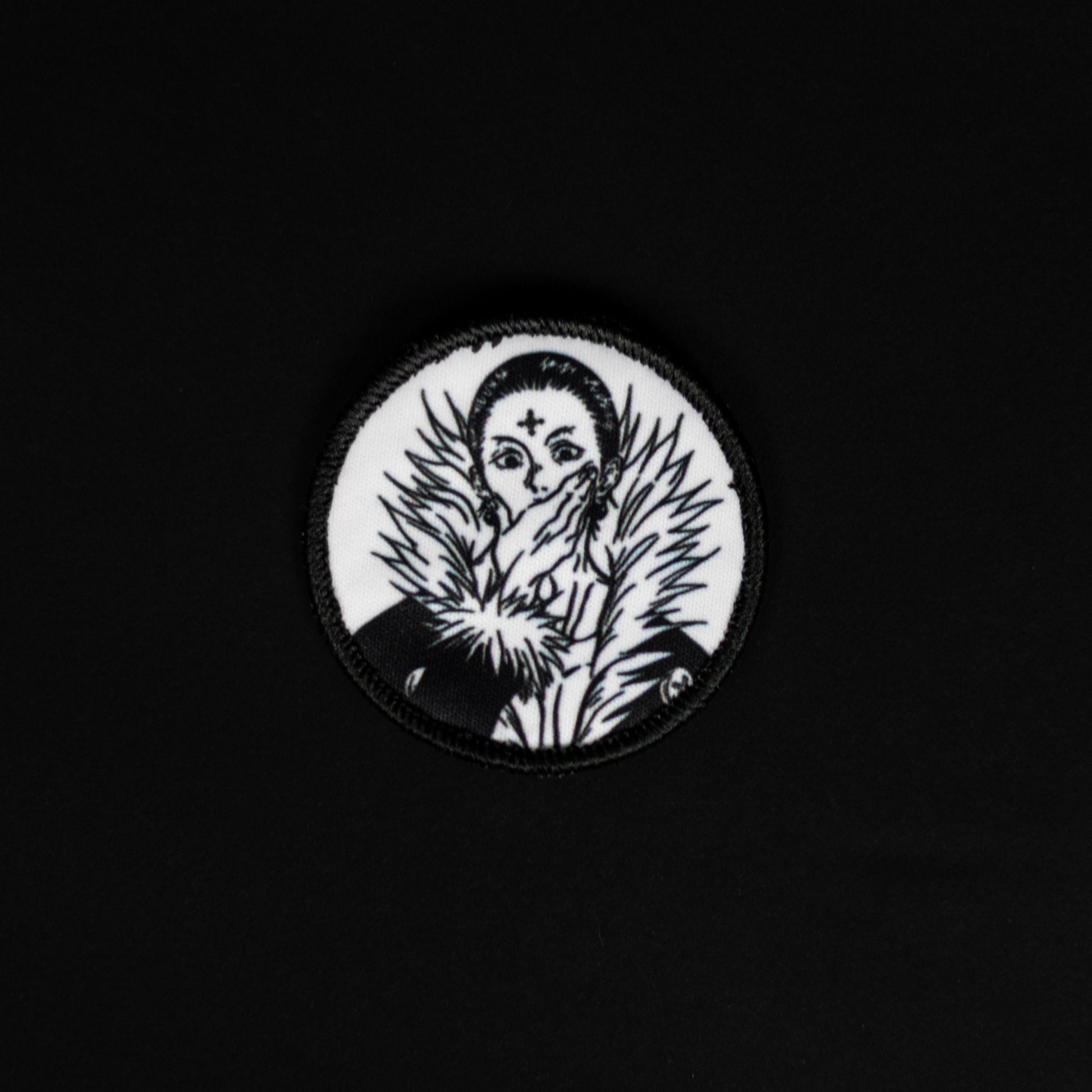 A top down view of the Chrollo embroidery patch.