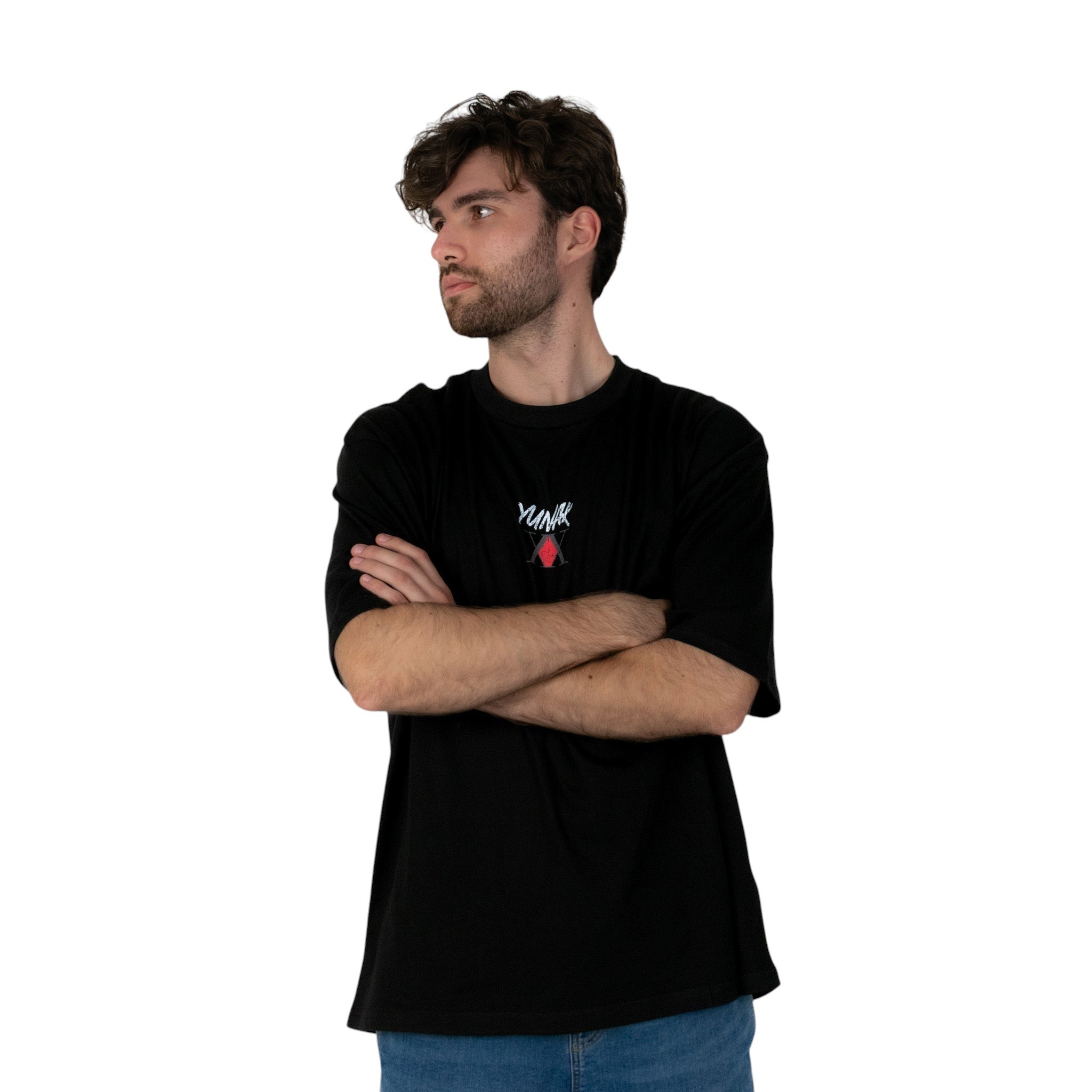 Person wearing a black t-shirt with Yunak x HunterxHunter graphic on the front, standing against a white background