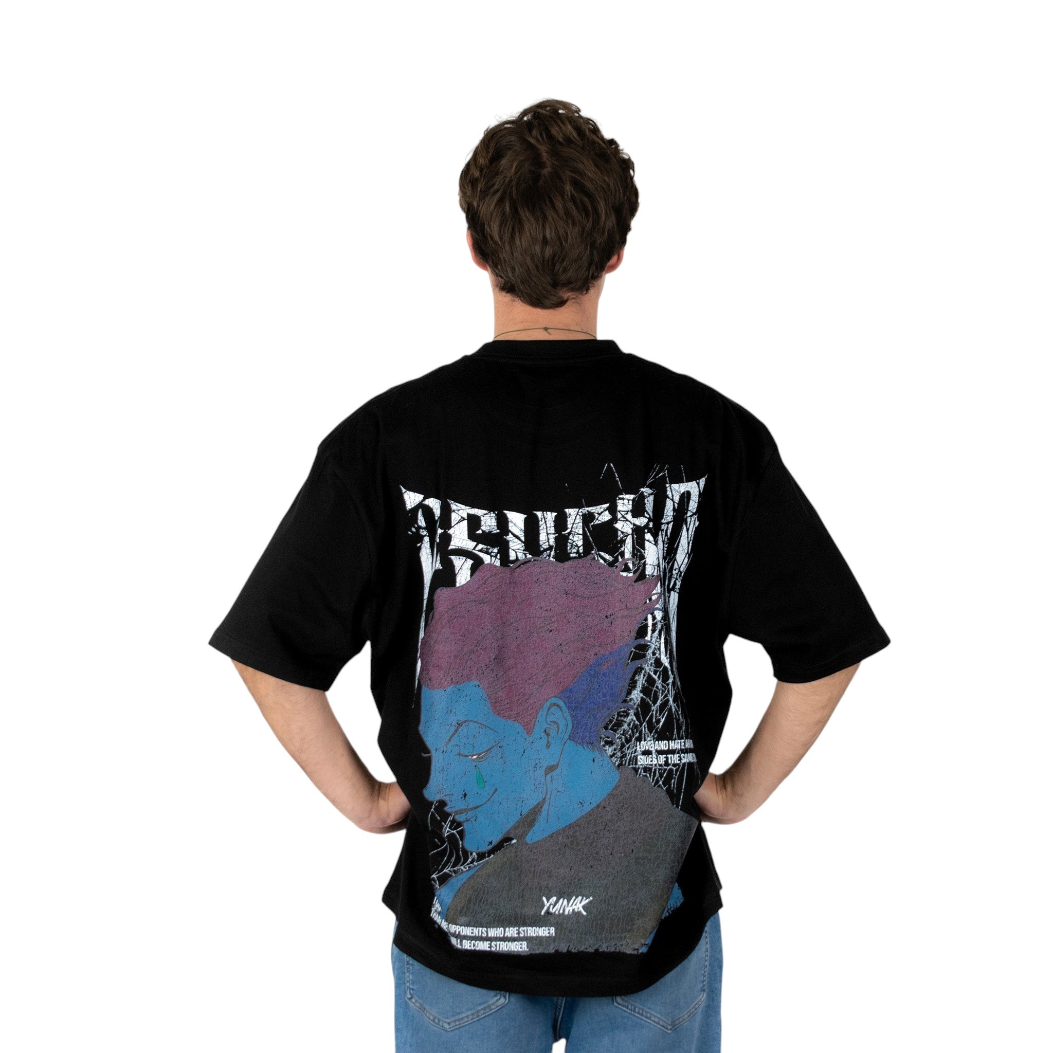 Person wearing a black t-shirt with graphic design of Hisoka from HunterxHunter on the back, standing against a white background