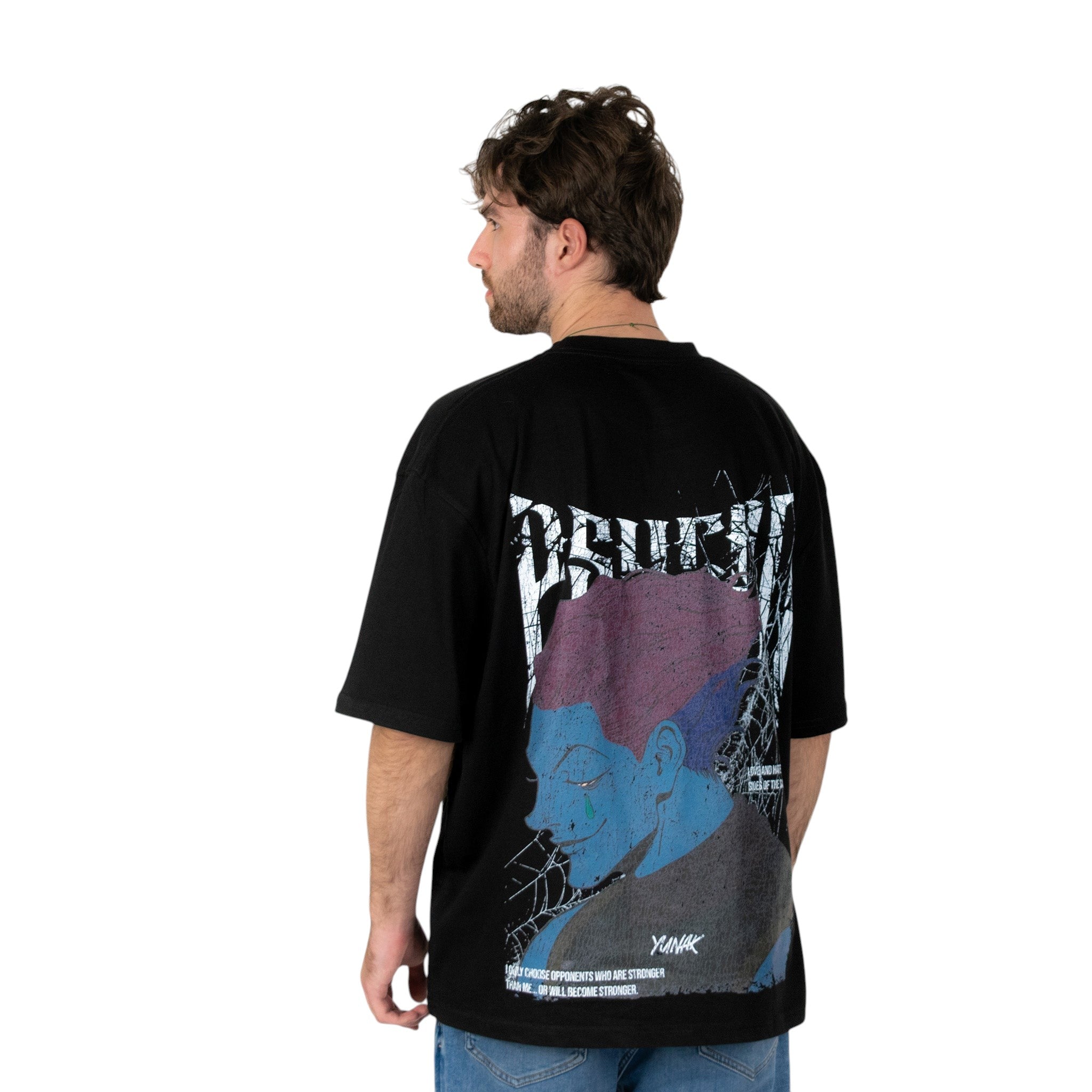 Person wearing a black t-shirt with graphic design of Hisoka from HunterxHunter on the back, standing against a white background
