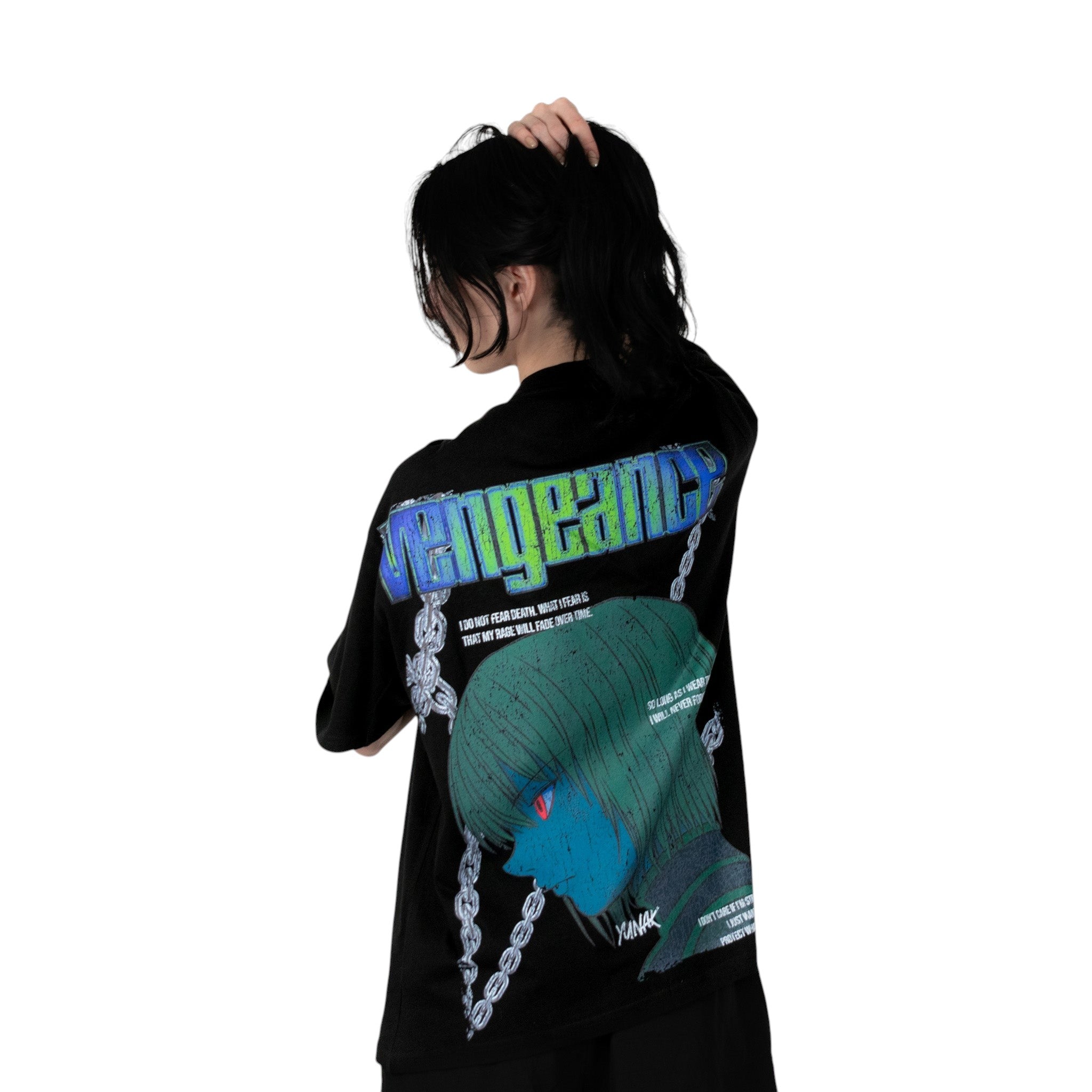 Person wearing a black t-shirt with graphic design of Kurapika from HunterxHunter on the back, standing against a white background