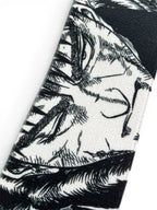 Embroidered anime wrist wraps inspired by Guts and Casca from Berserk. Anime lifting wraps for the gym. Close detail shot