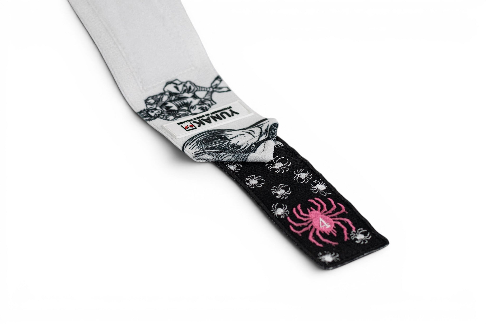 Embroidered anime wrist wraps inspired by Hisoka and the phantom troupe from HunterxHunter. Anime lifting wraps for the gym. Close detail shot