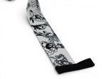 Embroidered anime wrist wraps inspired by Hisoka and the phantom troupe from HunterxHunter. Anime lifting wraps for the gym. Close detail shot