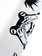Anime wrist wraps inspired by Megumi from Jujutsu Kaisen. Anime lifting wraps for the gym with jjk shikigami anime design for weightlifting. Close detail shot