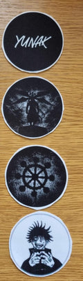 An anime powerlifting belt, 13mm thick and 4 inch wide. Featuring 4 embroidery patches inspired by Jujutsu Kaisen. First patch is Mahoraga's symbol, second is Megumi, third is featuring Mahoraga and the fourth is a Yunak's patch. The photo is frontal view of the belt.