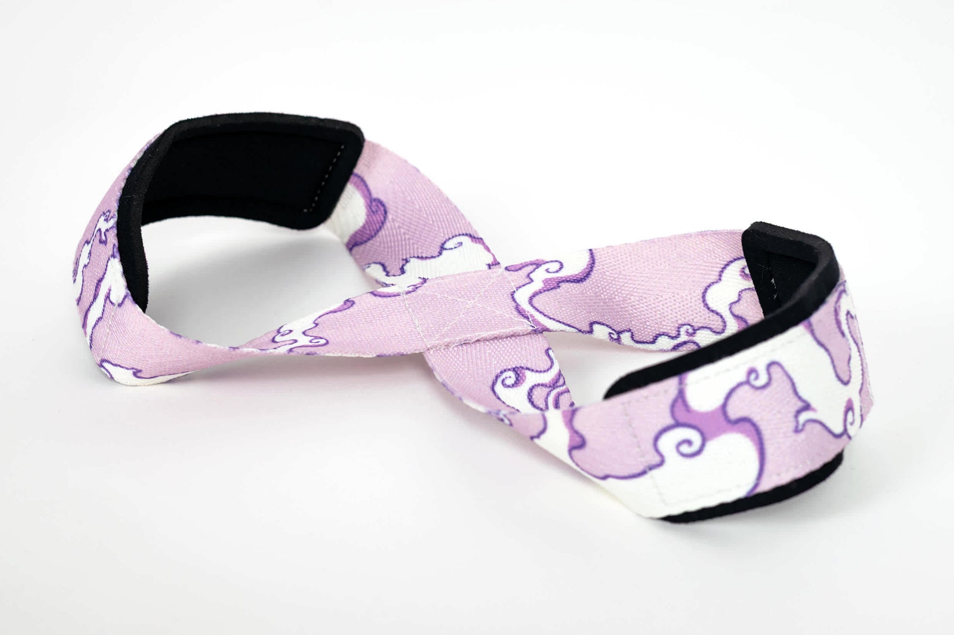 An 8 figure lifting strap with a Luffy Gear 5 pattern.