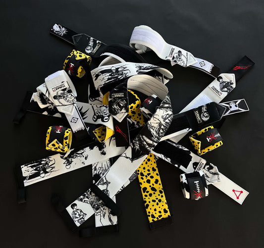 A mystery bundle containing one random pair of wrist wraps with anime inspired design. Picture shows a number of the anime wrist wraps that can be inside the package