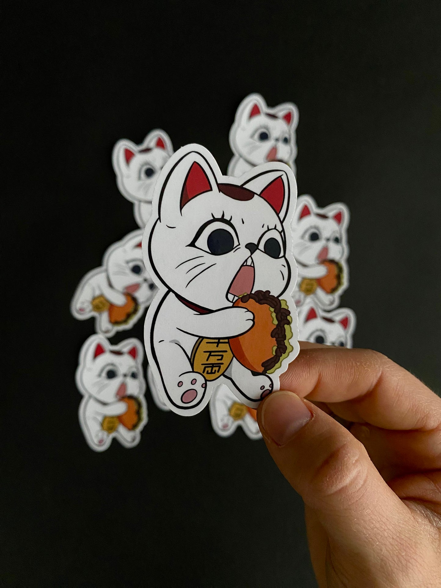 A close up of a sticker inspired by Turbo Granny as a kitty munching on food