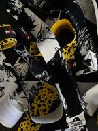 A mystery bundle containing one random pair of wrist wraps with anime inspired design. Picture shows a number of the anime wrist wraps that can be inside the package