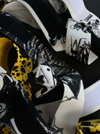 A mystery bundle containing one random pair of wrist wraps with anime inspired design. Picture shows a number of the anime wrist wraps that can be inside the package