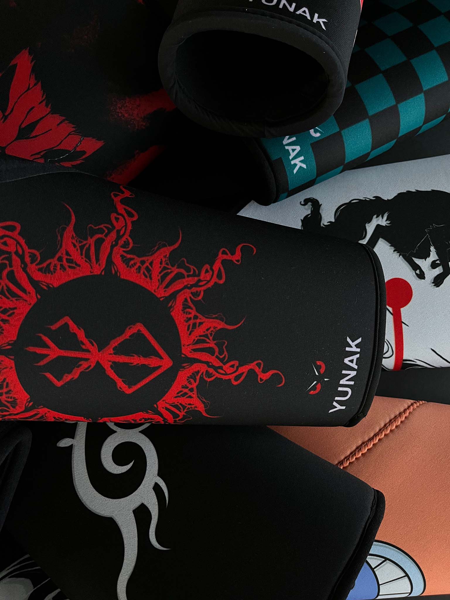 A mystery bundle containing one random pair of knee sleeves with anime inspired design. Picture shows a number of the anime knee sleeves that can be inside the package