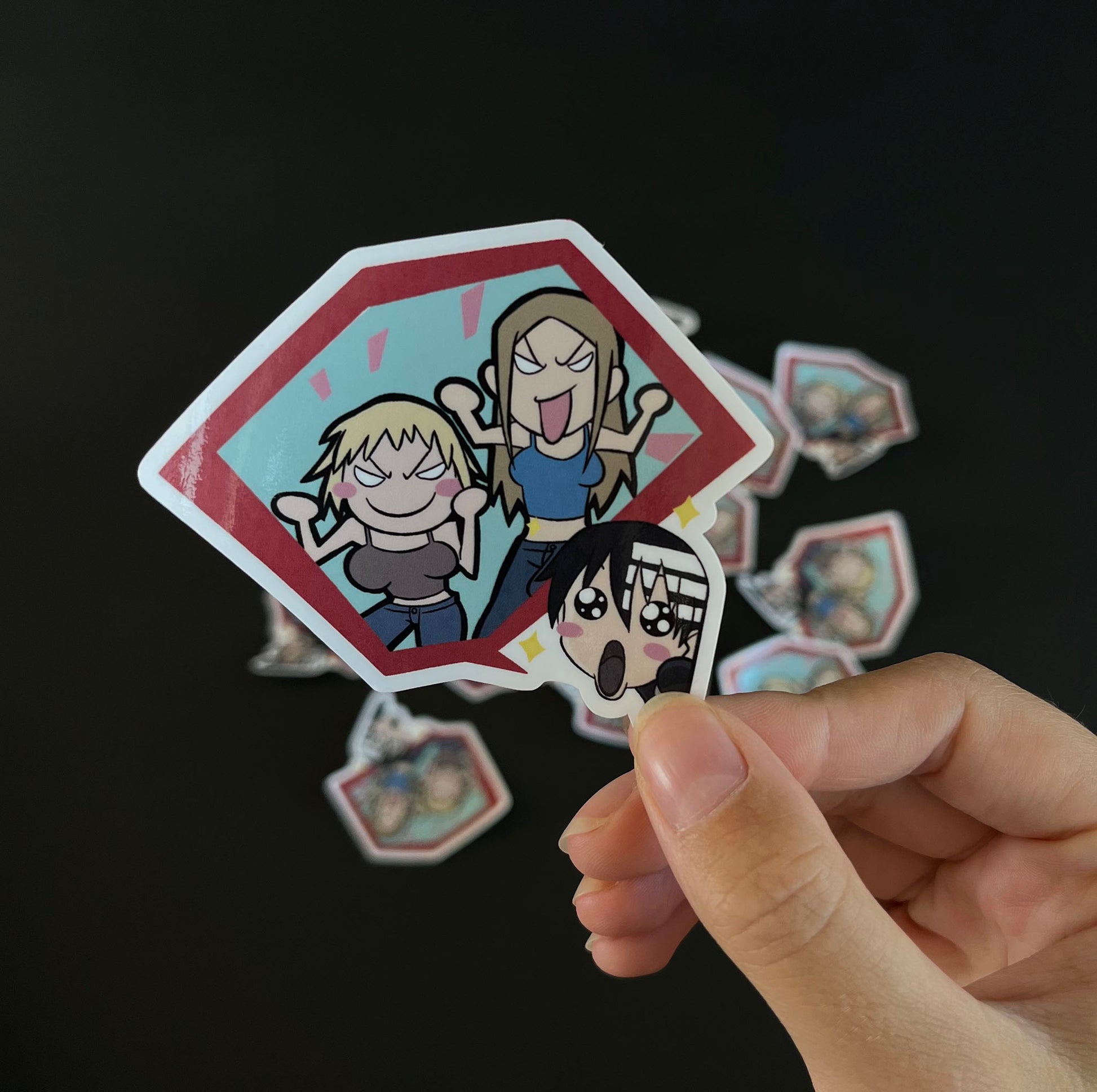 A close up of the sticker inspired by Death the Kid, Liz and Patty