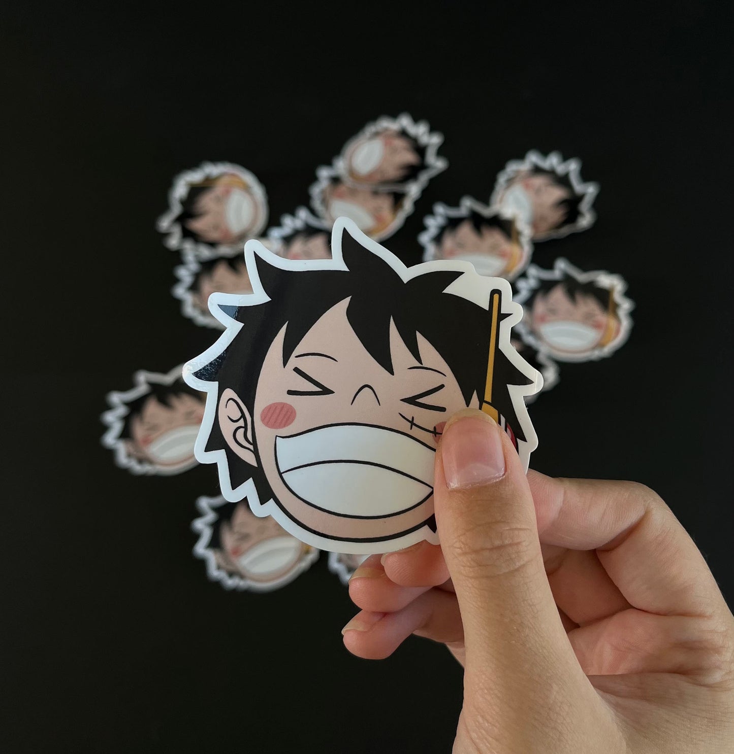 A close up of a sticker inspired by Luffy